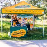 sponsor tent near a cart path during a charity golf tournament in Colorado