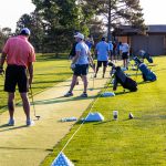 golfers lining up on the range during a pre-round of a charity golf tournament in Colorado