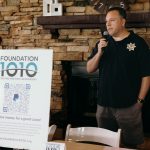 a denver latino sheriff officer giving a speech during the ceremony of a charity golf tournament
