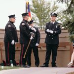 4 service man by an american flag