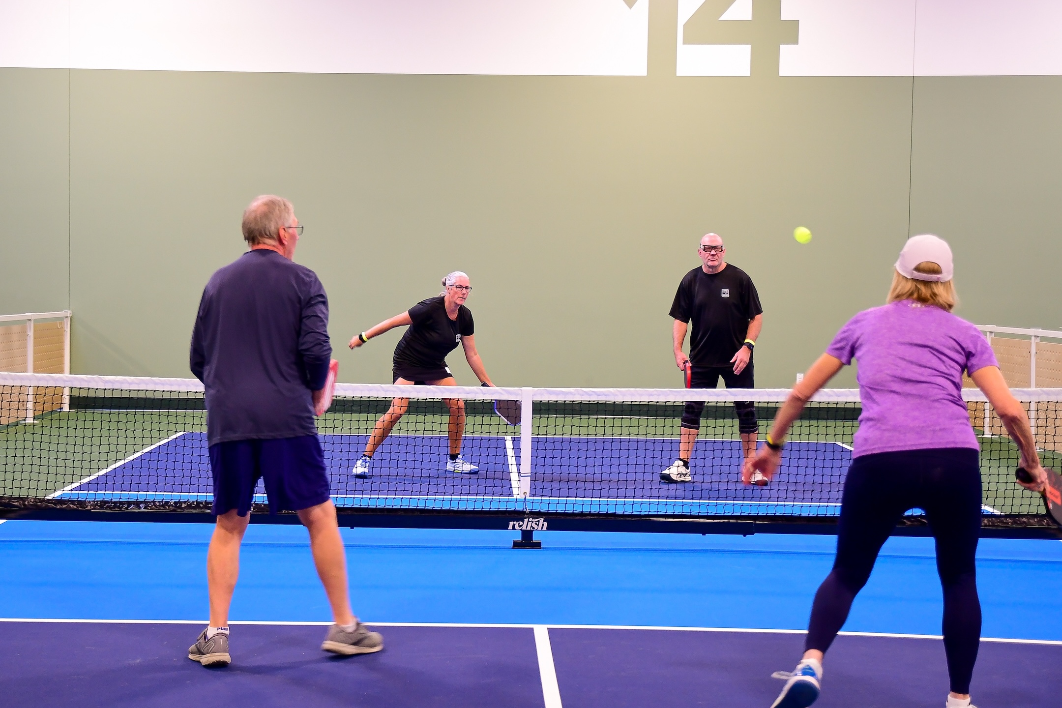 couples playing pickleball