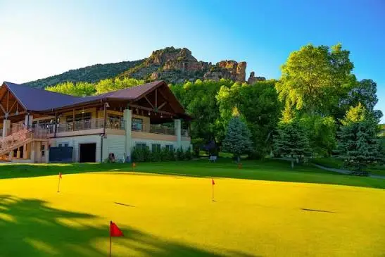 Rifle Creek Golf Course, a public golf course with two 9-hole tracks in Rifle, Colorado, set against the Hogback Ridge
