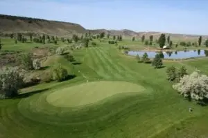 Mesa-top fairways at Cedar Ridges Golf Course overlooking the Book Cliffs near Rangely, Colorado
